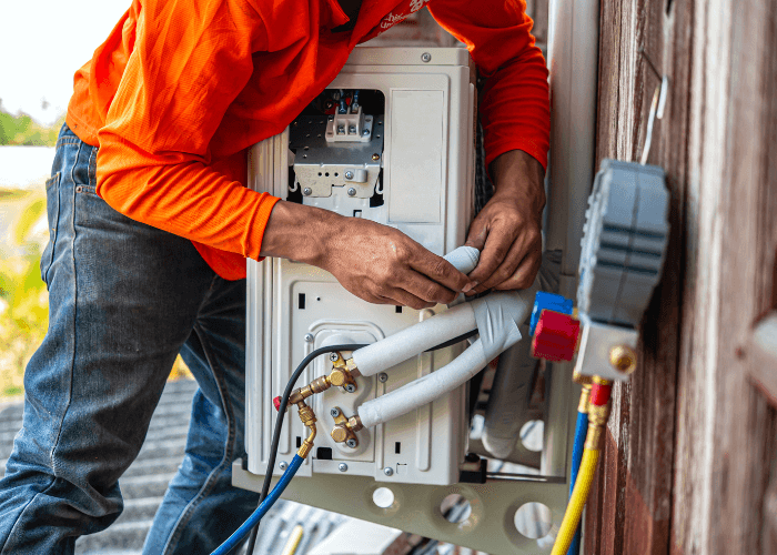 HVAC technician performing maintenance